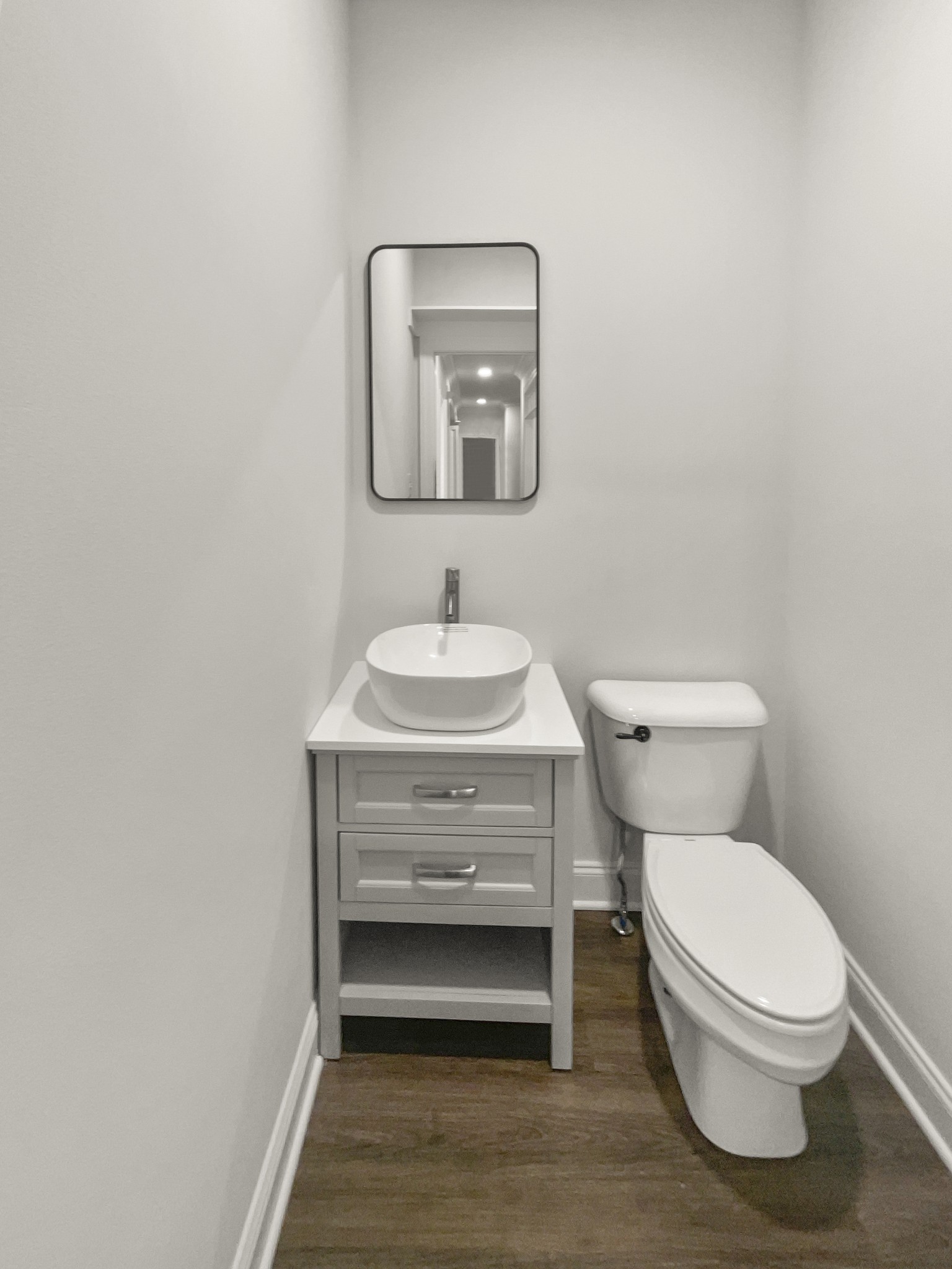 2058 Mossy Oak Circle Clarksville, TN 37043 - Photo 21 of 38 a bathroom with a toilet a sink and mirror