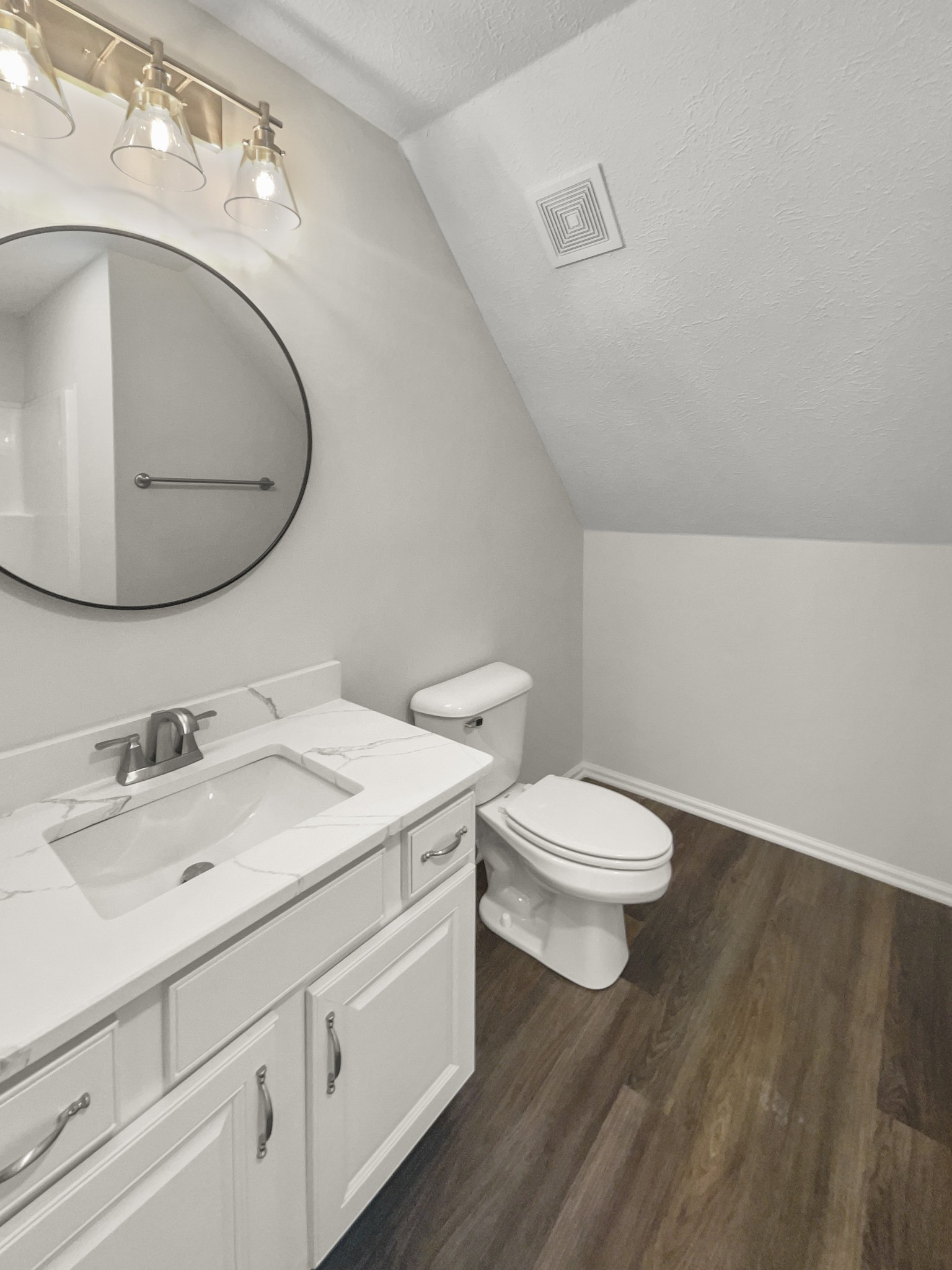 2058 Mossy Oak Circle Clarksville, TN 37043 - Photo 25 of 38 a bathroom with a toilet sink vanity and mirror