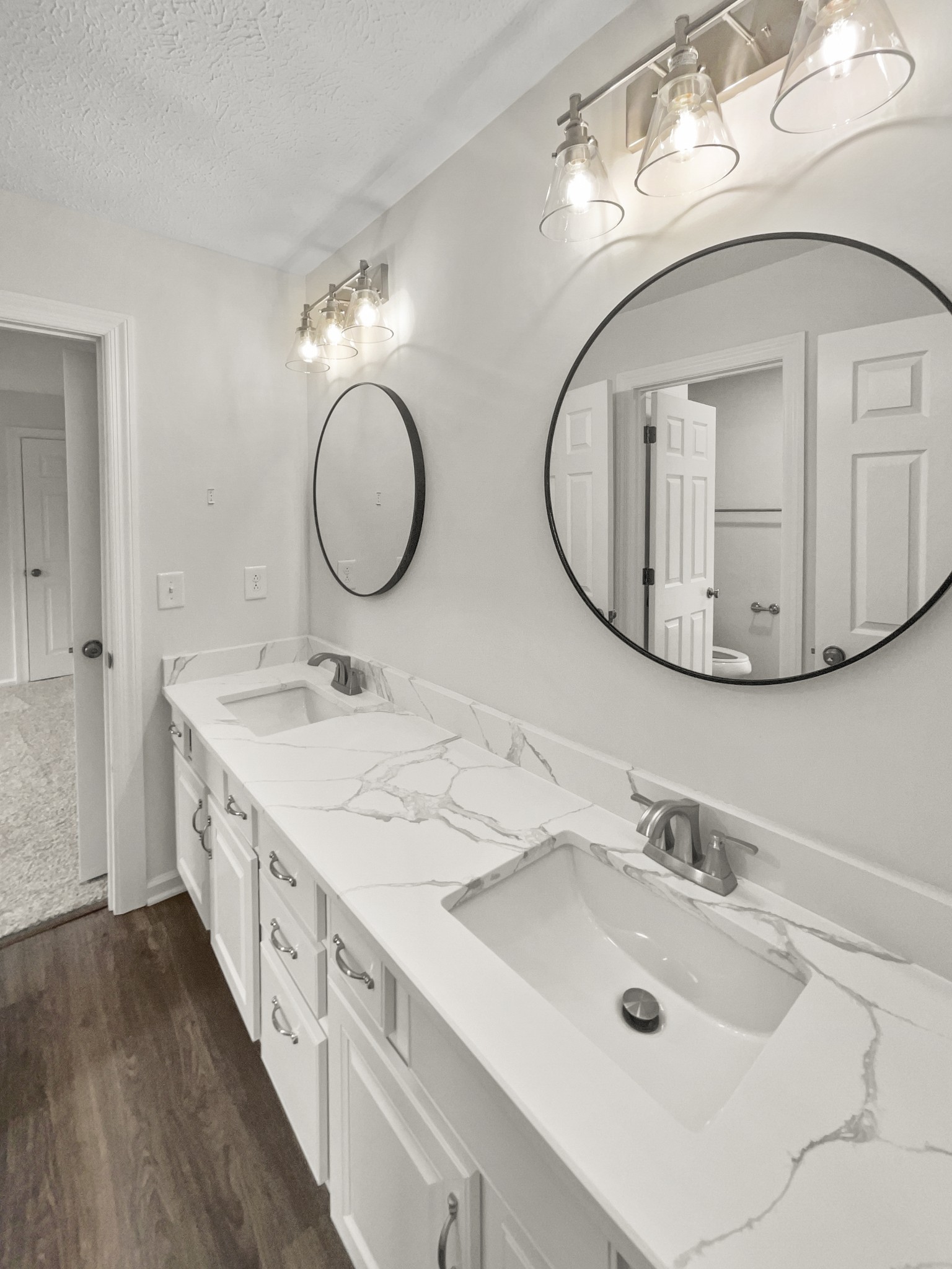 2058 Mossy Oak Circle Clarksville, TN 37043 - Photo 29 of 38 a bathroom with a double vanity sink and a mirror