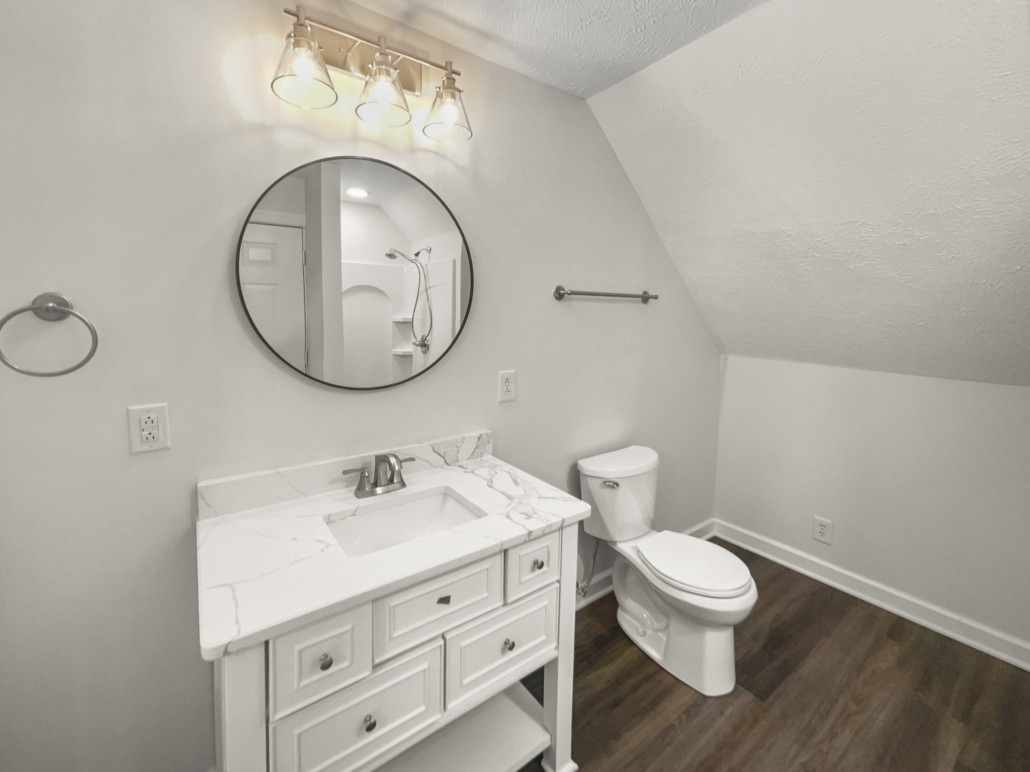 2058 Mossy Oak Circle Clarksville, TN 37043 - Photo 33 of 38 a bathroom with a toilet sink and mirror