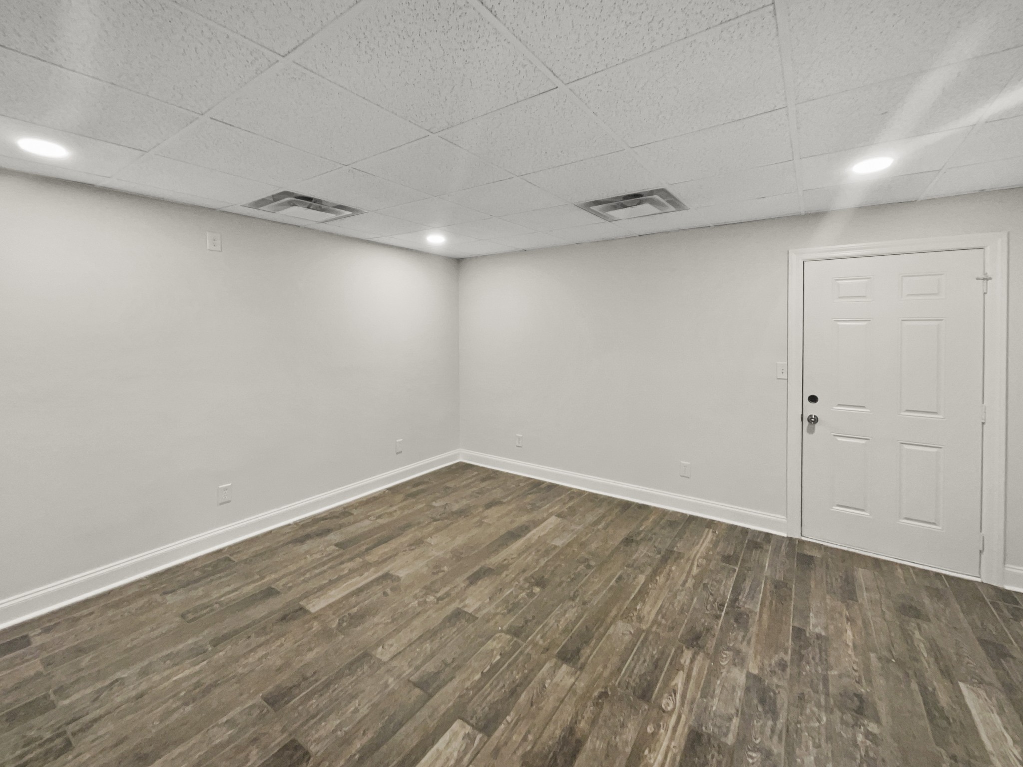 2058 Mossy Oak Circle Clarksville, TN 37043 - Photo 35 of 38 a view of an empty room with wooden floor and a window