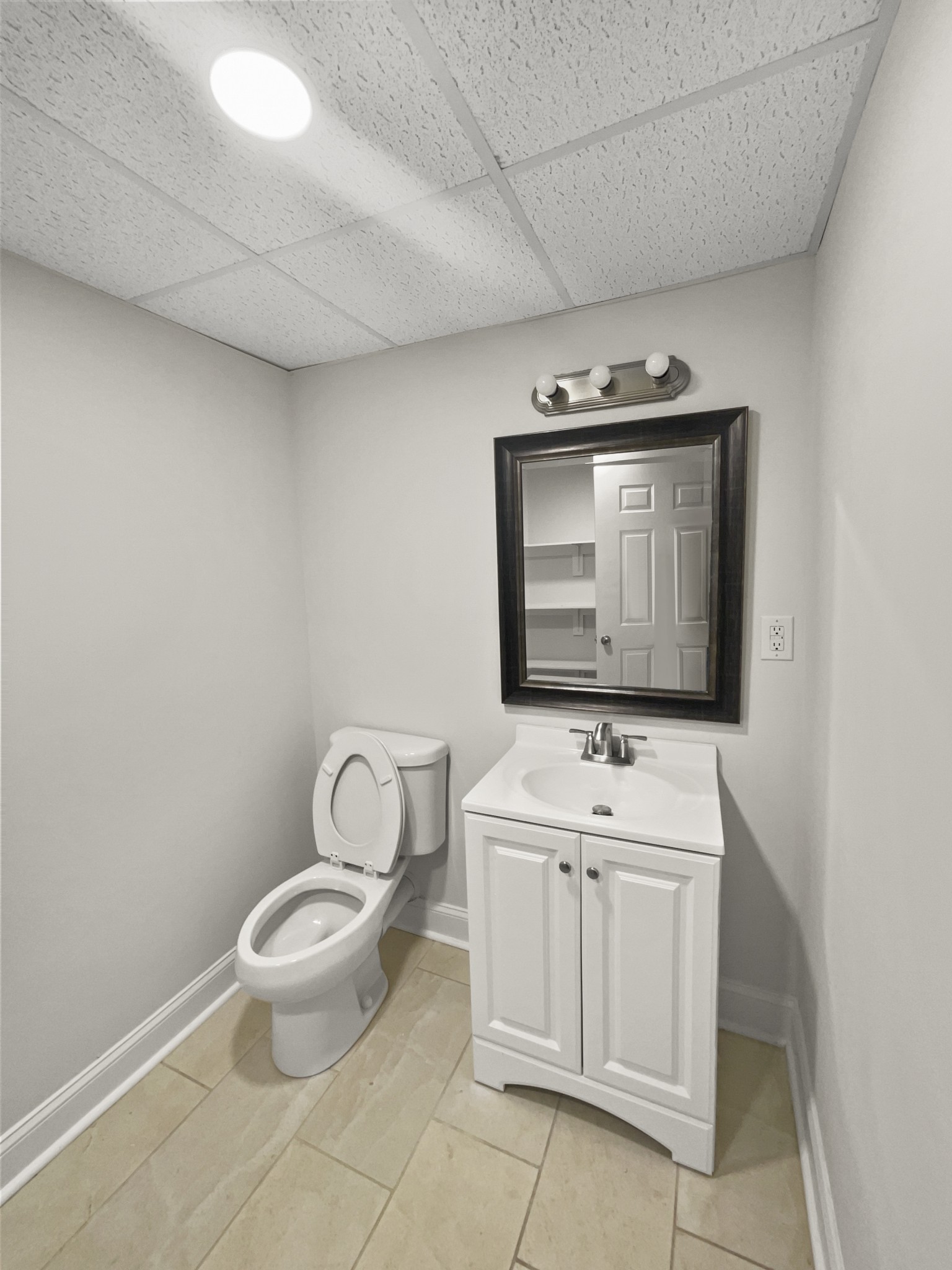 2058 Mossy Oak Circle Clarksville, TN 37043 - Photo 36 of 38 a bathroom with a sink toilet and mirror