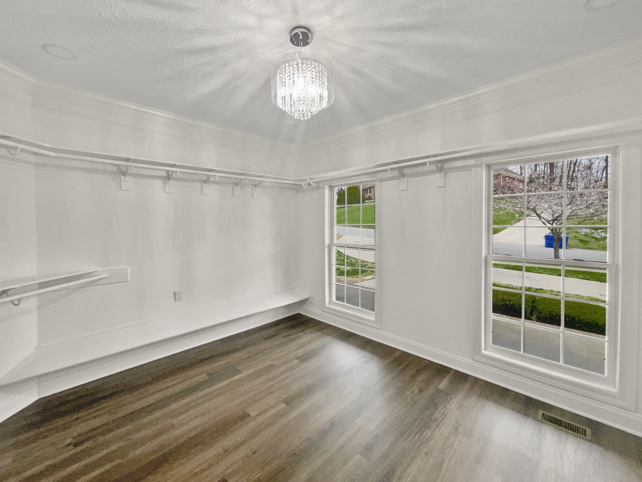 2058 Mossy Oak Circle Clarksville, TN 37043 - Photo 10 of 38 a view of an empty room with wooden floor and a window