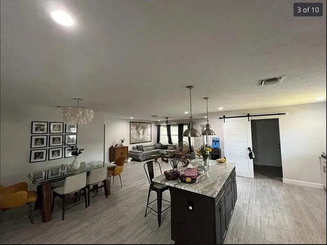 a kitchen with a table and chairs in it