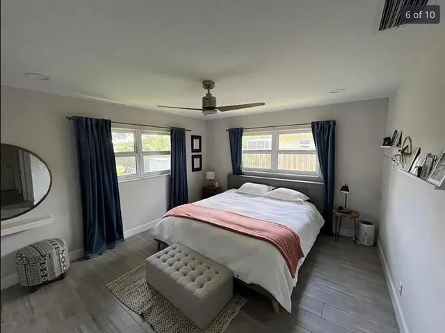 a bedroom with a bed closet and a window