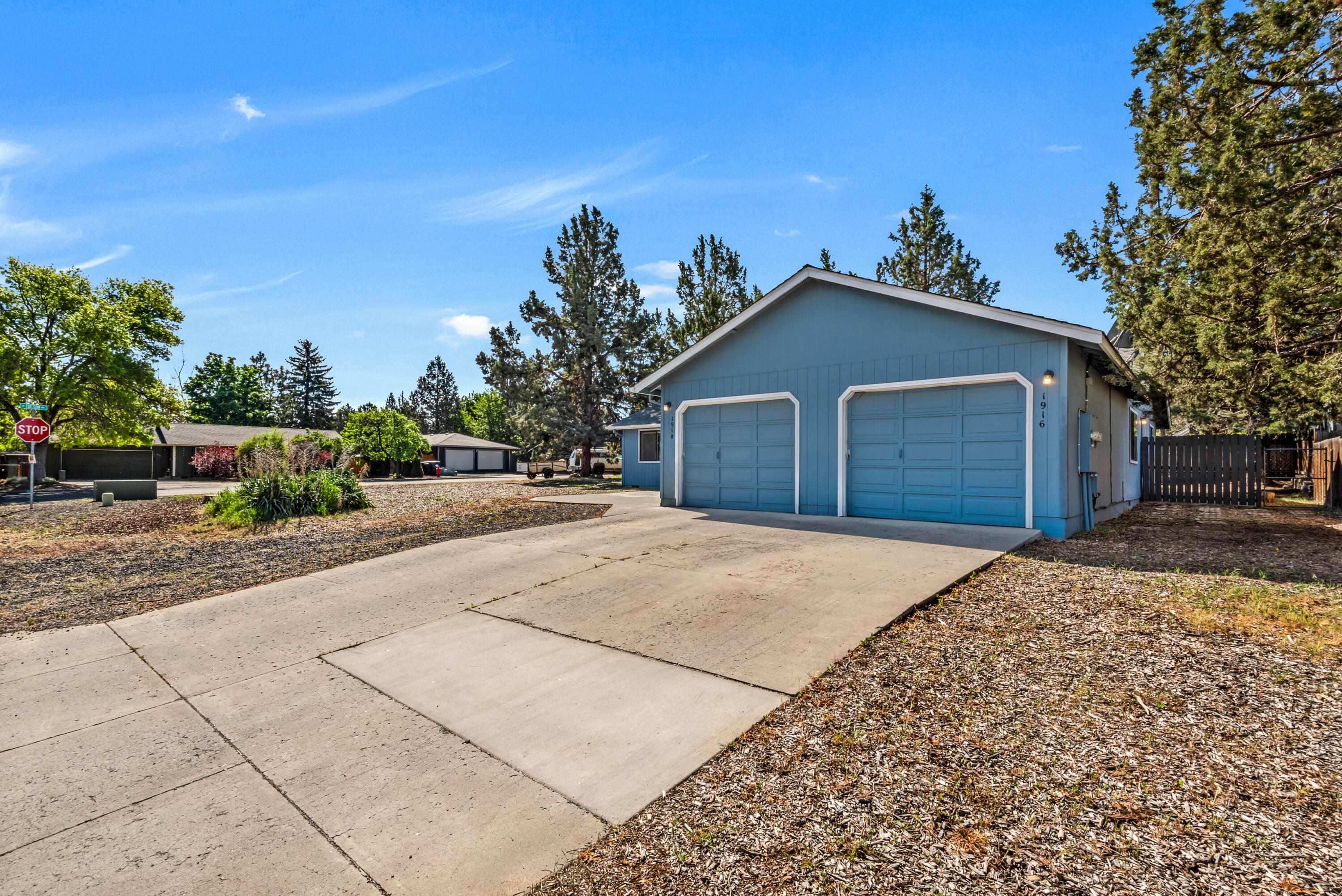 1916 Northeast Wichita Way Bend, OR 97701 - Photo 3 of 38 a front view of a house with a yard and garage
