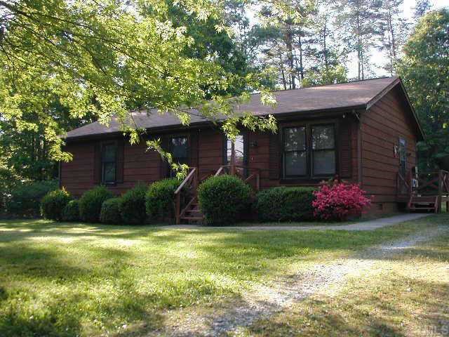 729 Bahama Road Bahama, NC 27503 - Photo 1 of 1 a front view of a house with a yard
