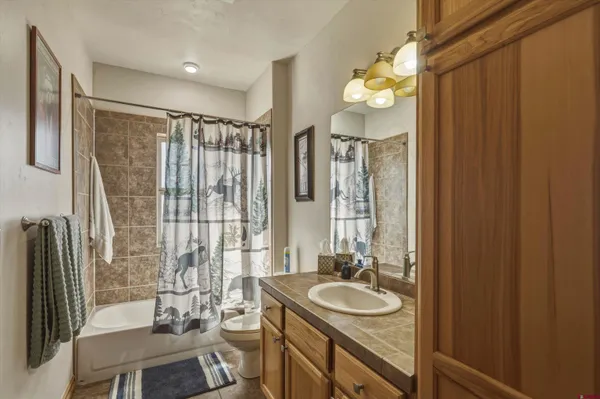 a bathroom with a sink a vanity and a mirror