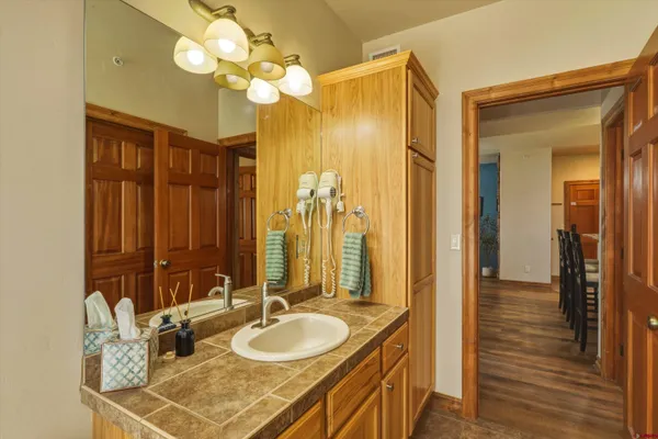 a view of a street with potted plants