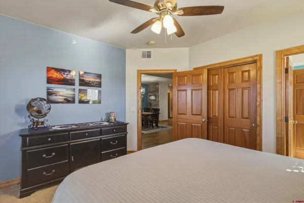 a kitchen with stainless steel appliances granite countertop a sink and a refrigerator