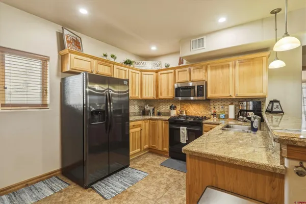 a view of a dining room with furniture