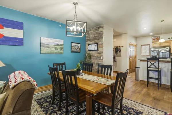 a living room with furniture wooden floor and a window