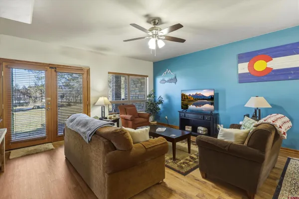 a living room with furniture and a flat screen tv