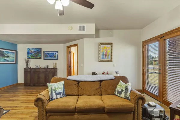 a bathroom with a granite countertop sink and a bathtub