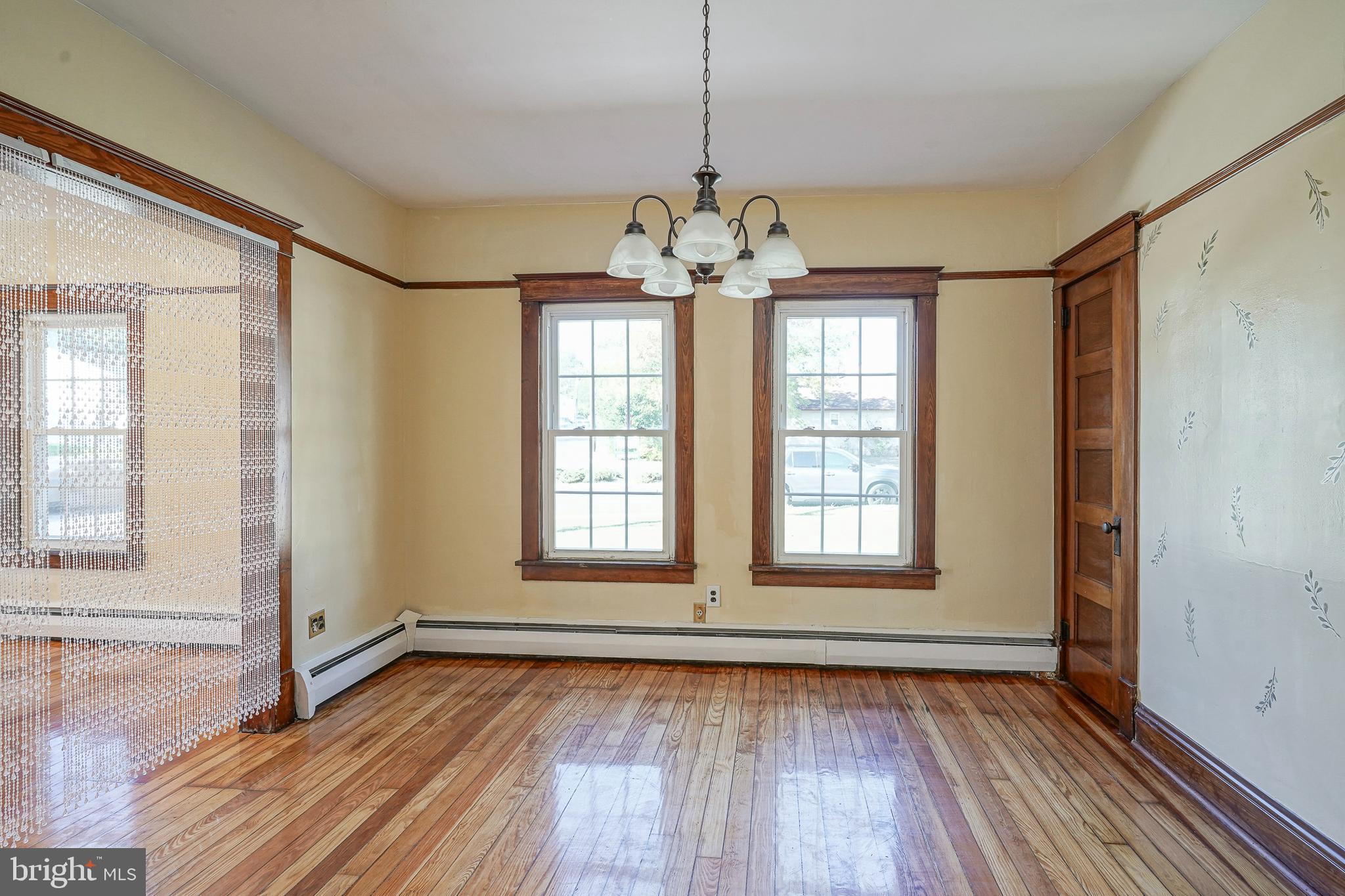 166 East Evesham Road Cherry Hill, NJ 08003 - Photo 12 of 34 a view of an empty room with wooden floor and a window
