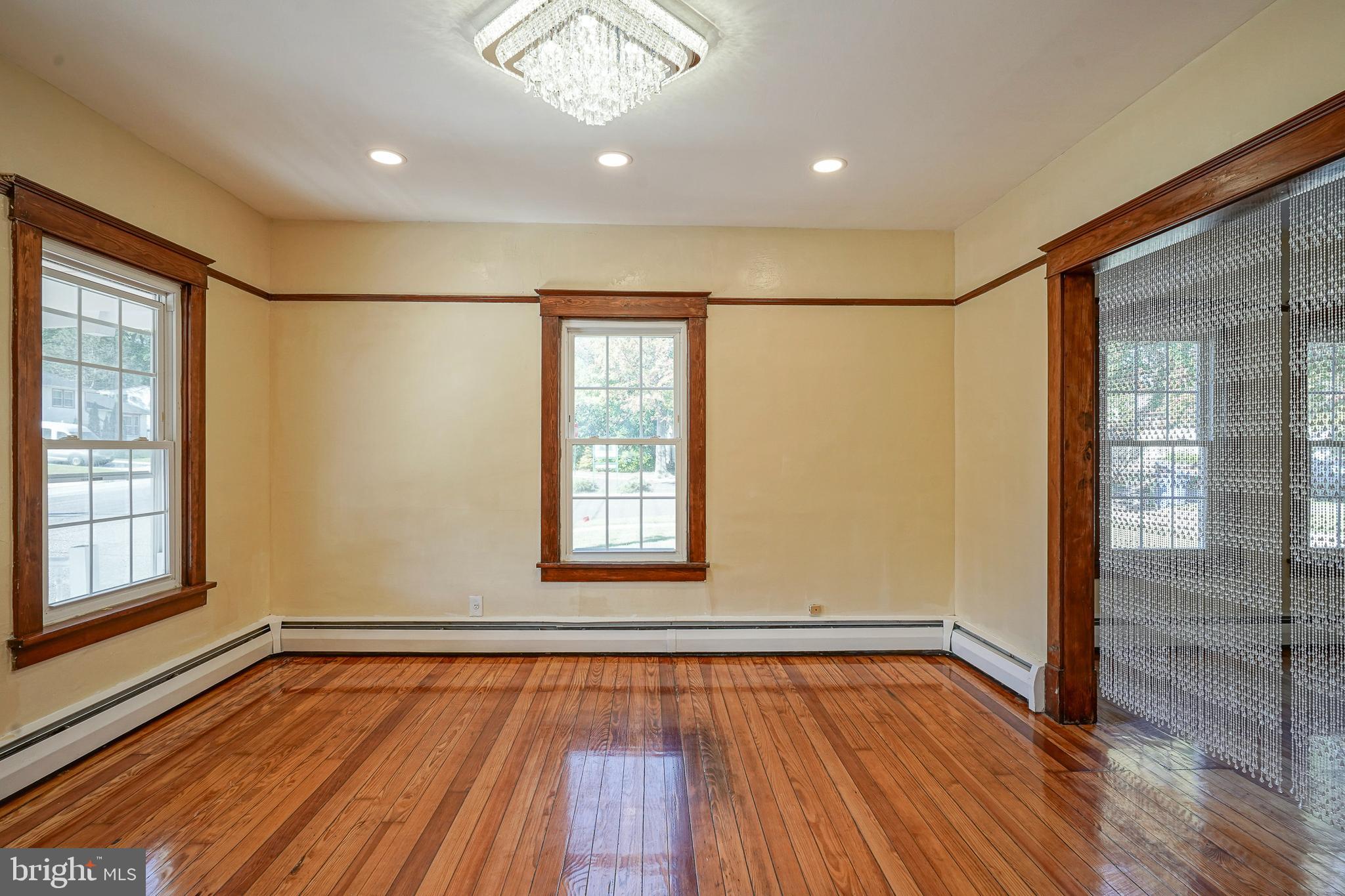 166 East Evesham Road Cherry Hill, NJ 08003 - Photo 14 of 34 a view of an empty room with wooden floor and a window