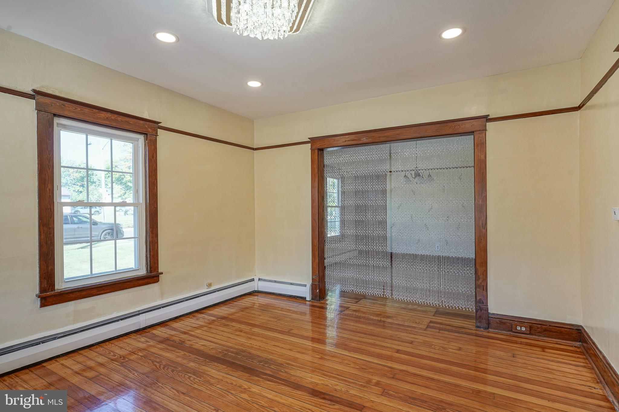 166 East Evesham Road Cherry Hill, NJ 08003 - Photo 15 of 34 an empty room with wooden floor and windows