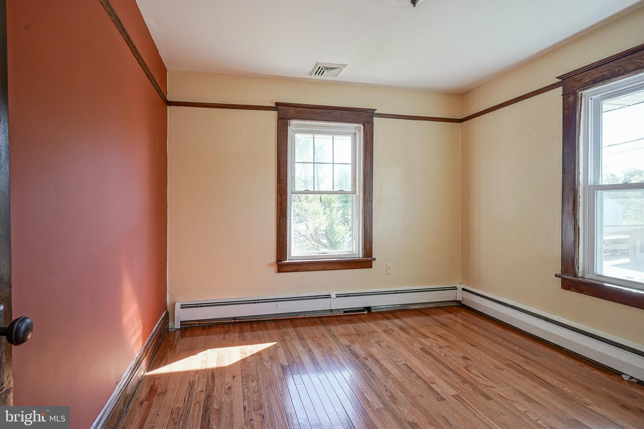 166 East Evesham Road Cherry Hill, NJ 08003 - Photo 17 of 34 a view of an empty room with wooden floor and a window
