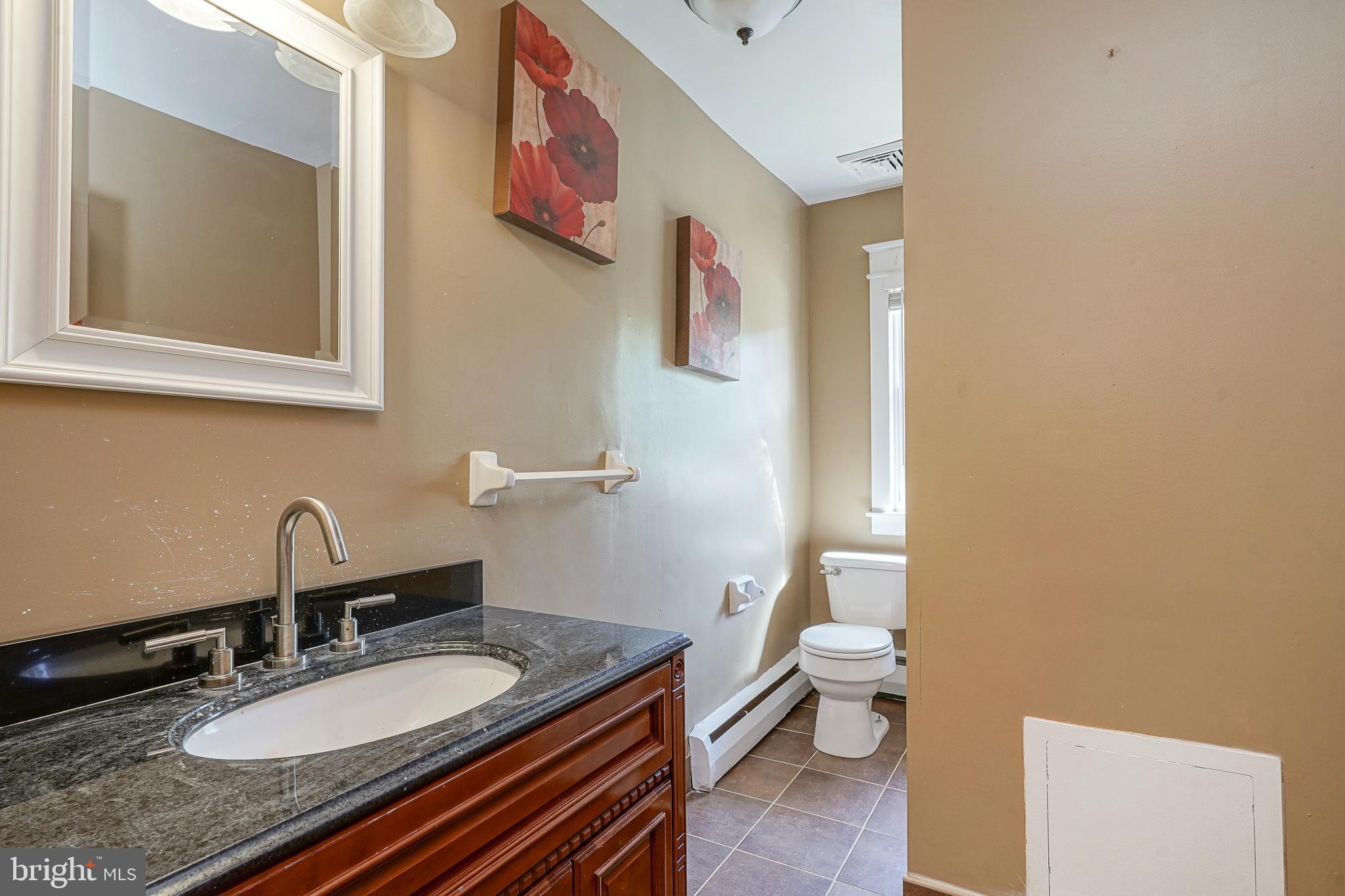 166 East Evesham Road Cherry Hill, NJ 08003 - Photo 21 of 34 a bathroom with a granite countertop sink and a mirror