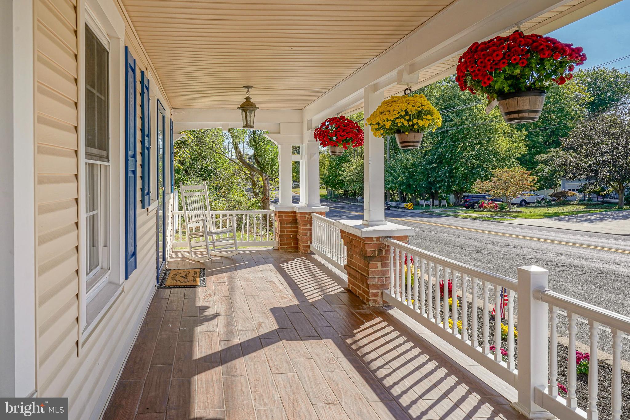 166 East Evesham Road Cherry Hill, NJ 08003 - Photo 3 of 34 a view of a patio with table and chairs and wooden floor