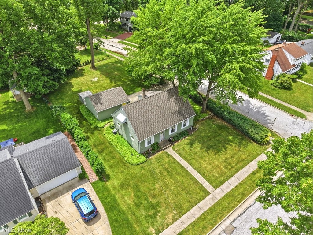 161 Pinehurst Road Munroe Falls, OH 44262 - Photo 37 of 40 Residential property featuring a green exterior, gabled roof, and a detached shed