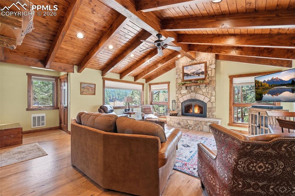 89 Ranch View Road Florissant, CO 80816 - Photo 15 of 50 Natural hardwood floors compliment the exquisite ceiling, creating a room that is both relaxing and mesmerizing.