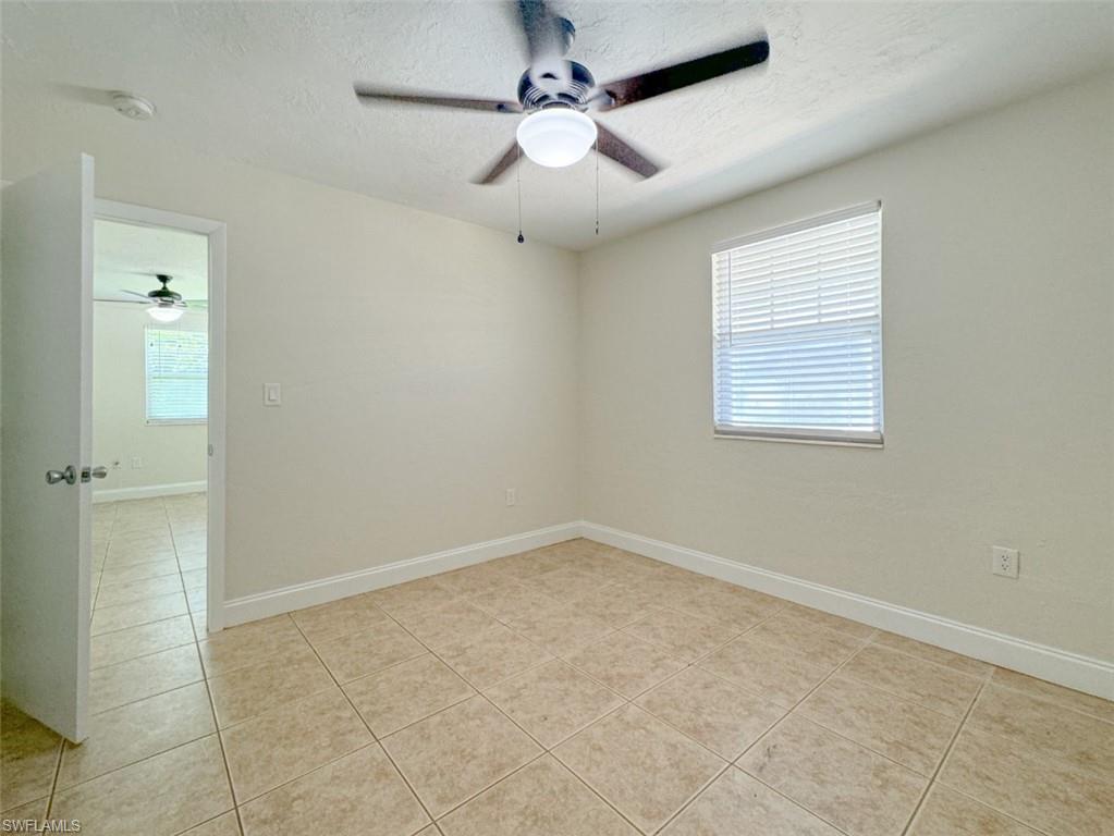 746 109th Avenue North Naples, FL 34108 - Photo 12 of 22 a view of an empty room with a window