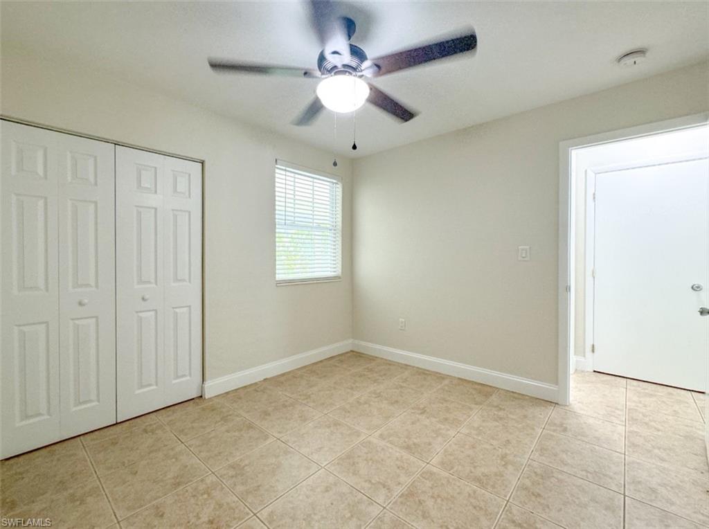 746 109th Avenue North Naples, FL 34108 - Photo 17 of 22 an empty room with fan and windows