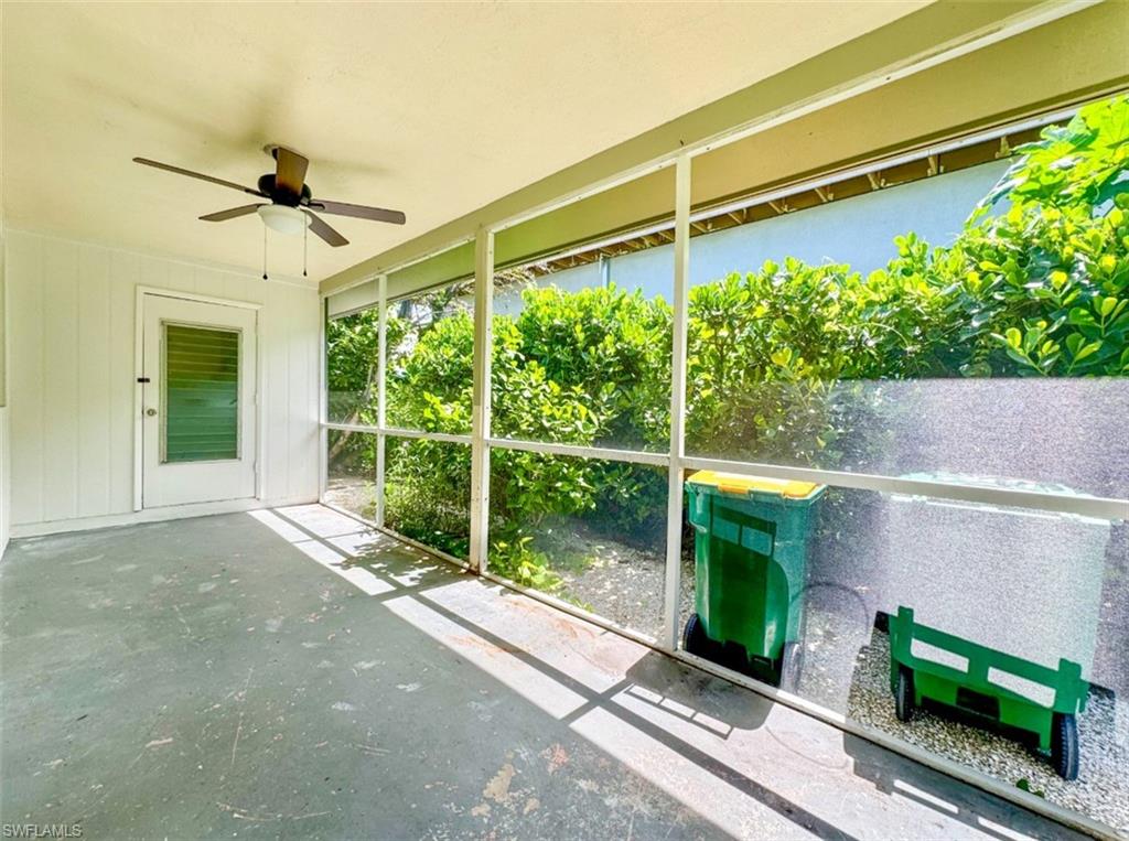 746 109th Avenue North Naples, FL 34108 - Photo 2 of 22 a house view with a garden space