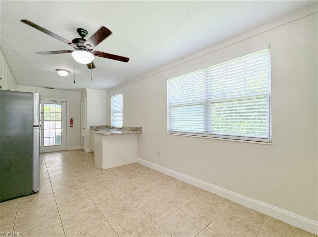 746 109th Avenue North Naples, FL 34108 - Photo 8 of 22 a view of kitchen with window and ceiling fan