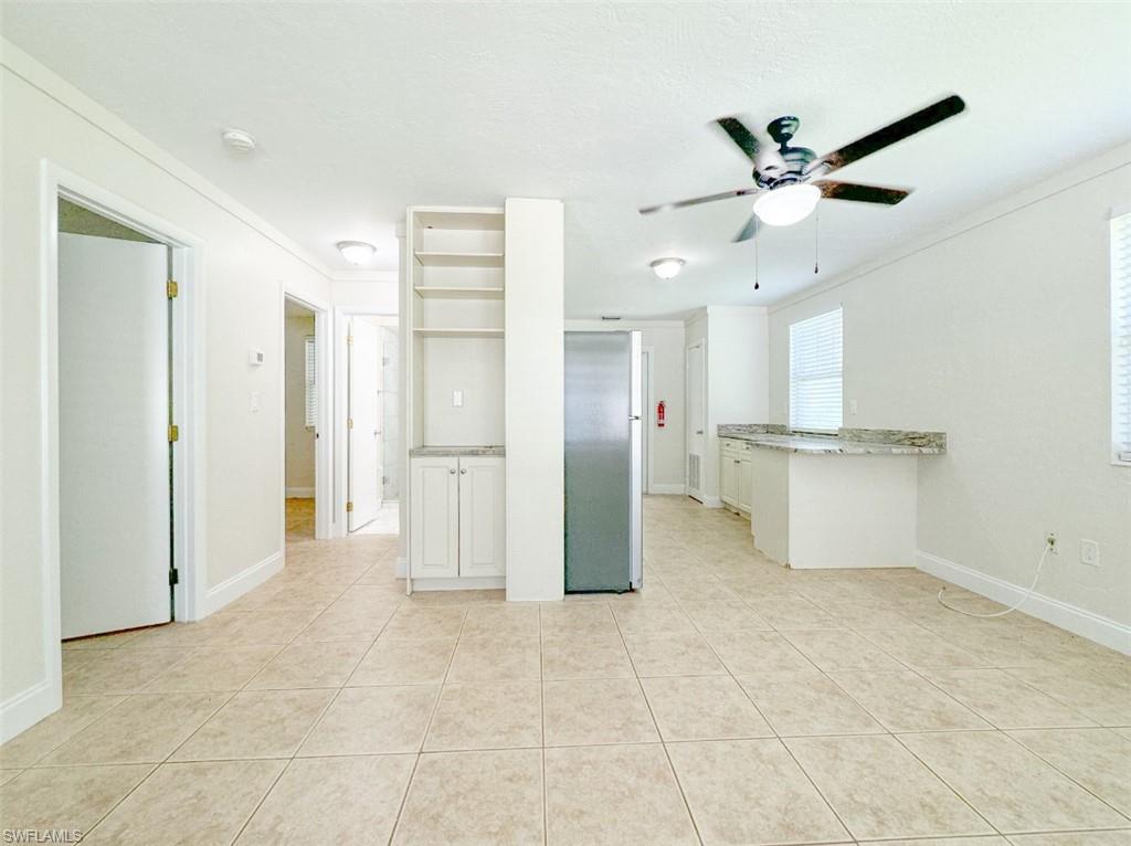 746 109th Avenue North Naples, FL 34108 - Photo 9 of 22 a view of a kitchen with a refrigerator and a sink