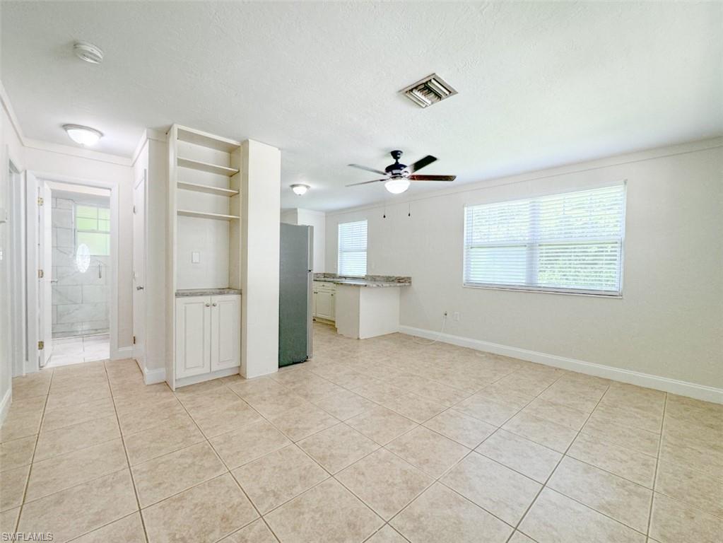 746 109th Avenue North Naples, FL 34108 - Photo 10 of 22 a view of a kitchen with a dishwasher and a refrigerator