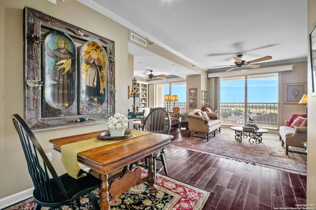 a living room with furniture a window and a chandelier