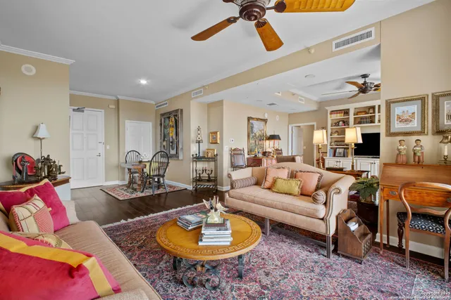 a living room with furniture rug and window