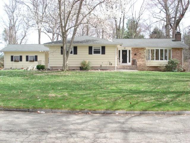 2 Inwood Road Norwalk, CT 06850 - Photo 1 of 1 a front view of a house with a garden