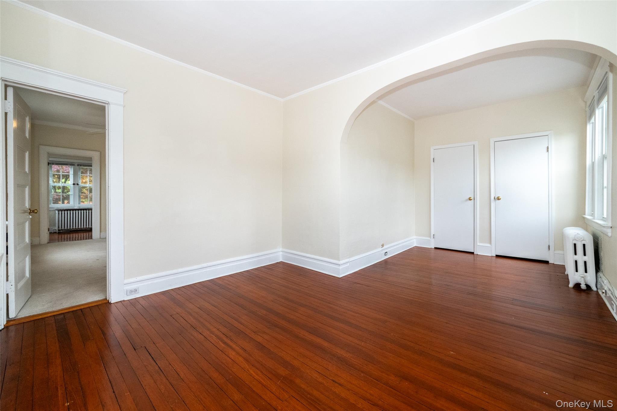 82 Clove Road New Rochelle, NY 10801 - Photo 15 of 39 wooden floor in an empty room