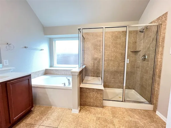 a bathroom with a shower and a sink