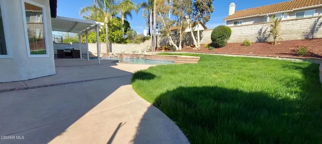 a view of a backyard of the house