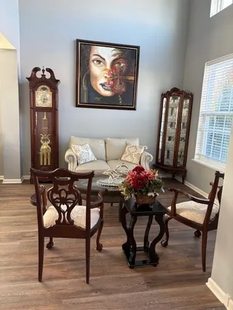 a living room with furniture and a window