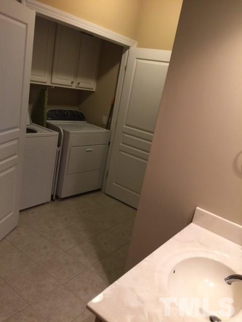 7510 Lead Mine Road, Unit 106 Raleigh, NC 27615 - Photo 16 of 22 a utility room with dryer and washer