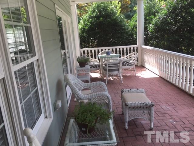 7510 Lead Mine Road, Unit 106 Raleigh, NC 27615 - Photo 17 of 22 a view of balcony with furniture and garden