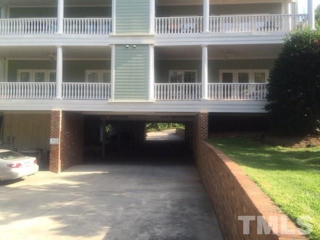 7510 Lead Mine Road, Unit 106 Raleigh, NC 27615 - Photo 20 of 22 a front view of a house with a yard