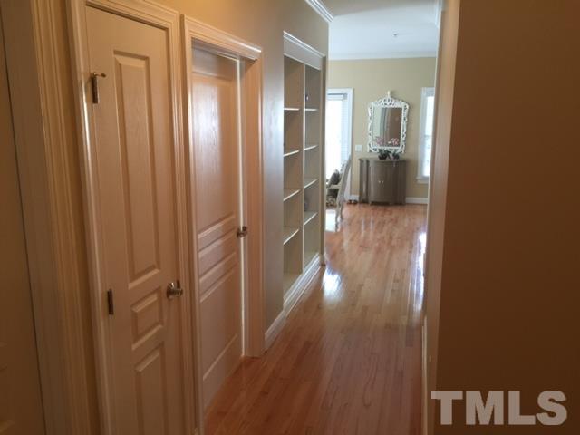 7510 Lead Mine Road, Unit 106 Raleigh, NC 27615 - Photo 5 of 22 a view of a hallway with wooden floor
