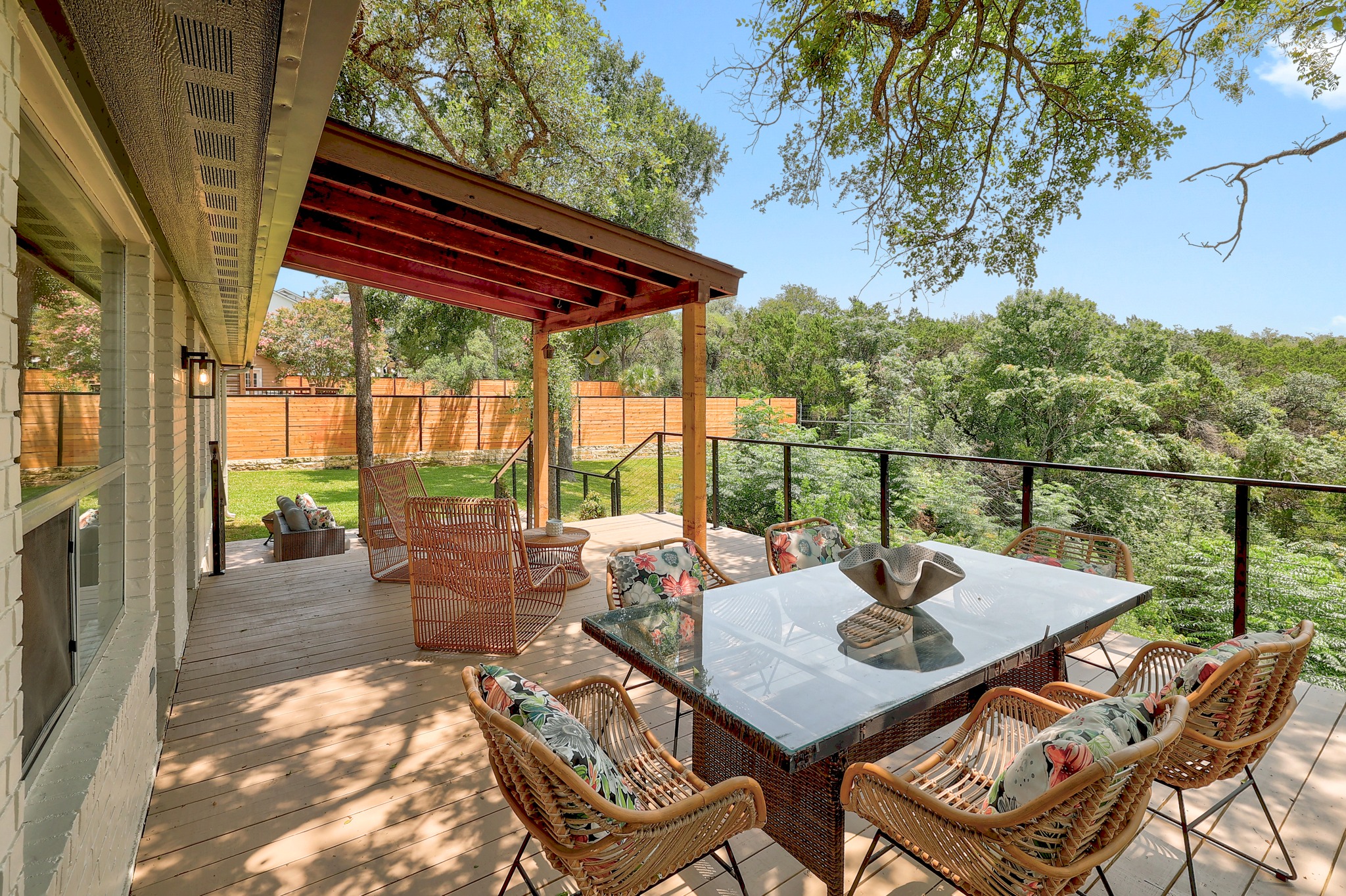 7705 Jester Boulevard Austin, TX 78730 - Photo 23 of 36 An inviting deck offers a scenic view of abundant mature trees and a private outdoor setting.