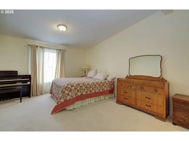a bedroom with two beds and painted walls