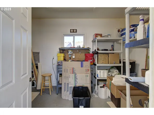 a grassy field with trees in the background