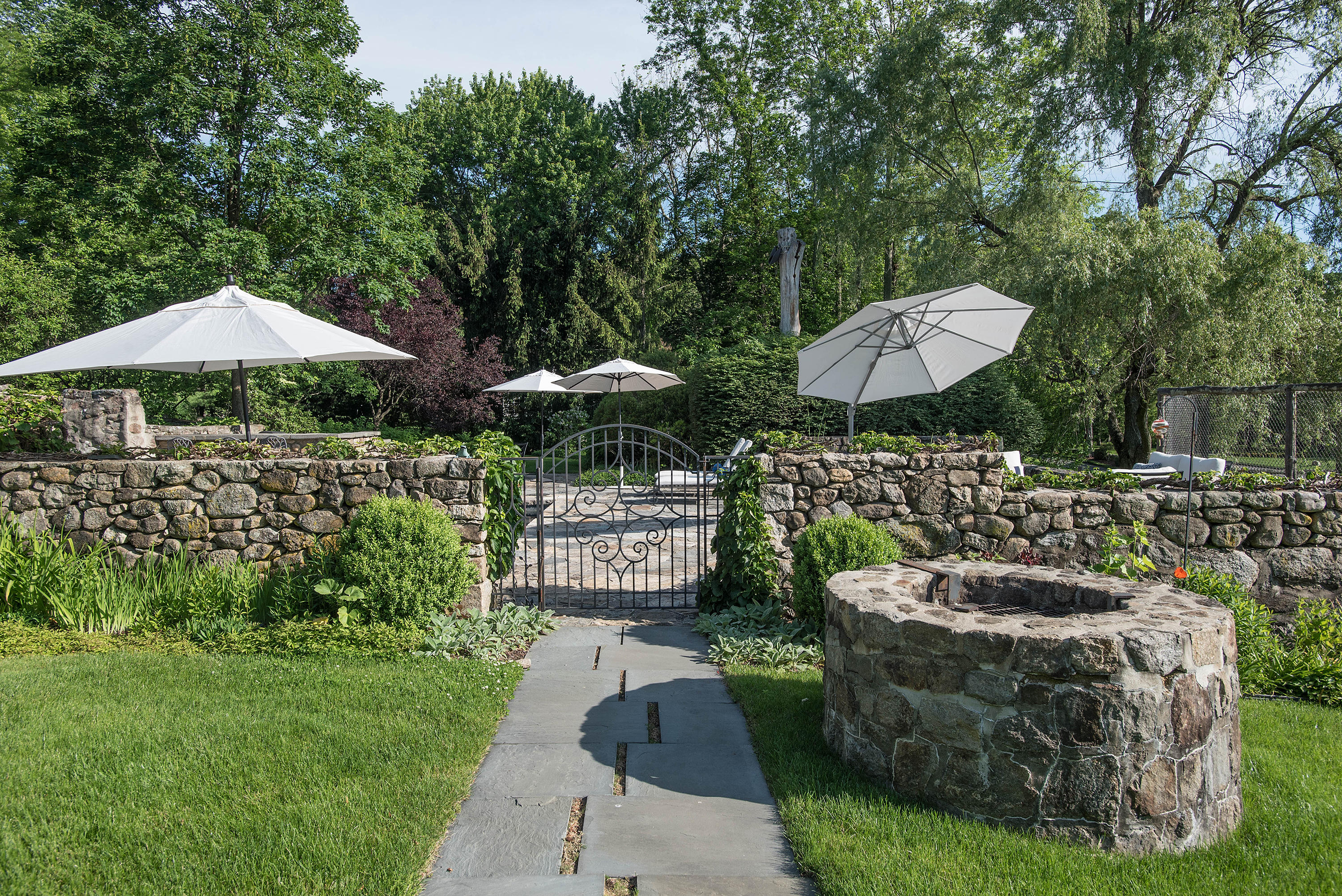314 Brushy Ridge Road New Canaan, CT 06840 - Photo 17 of 23 a view of a garden with patio