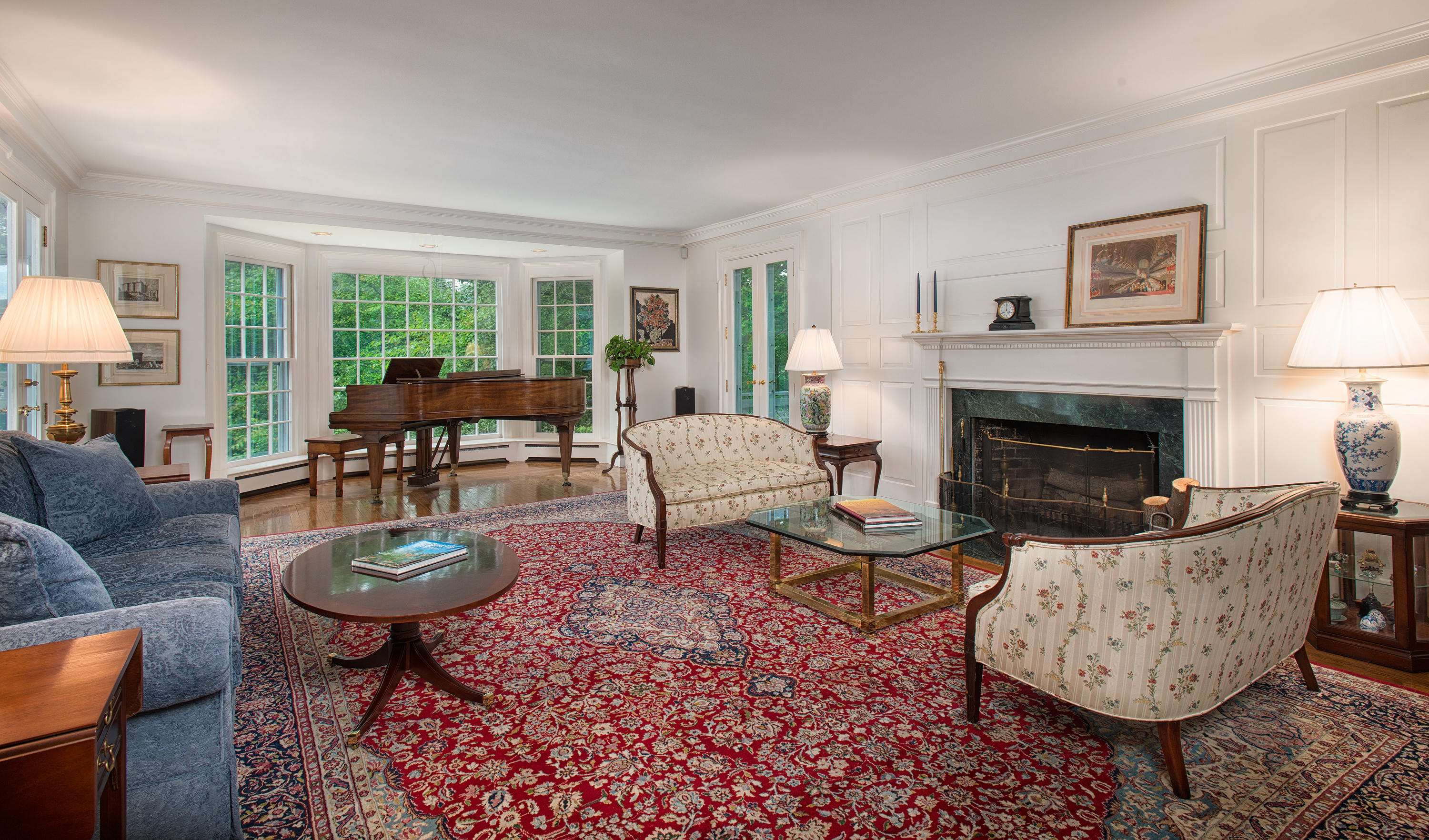 314 Brushy Ridge Road New Canaan, CT 06840 - Photo 3 of 23 a living room with furniture a fireplace a lamp and a large window