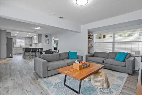 a living room with furniture and a table