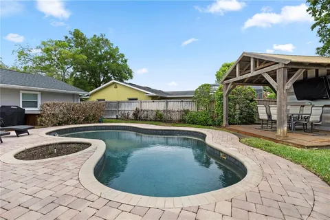 a view of swimming pool with lounge chair